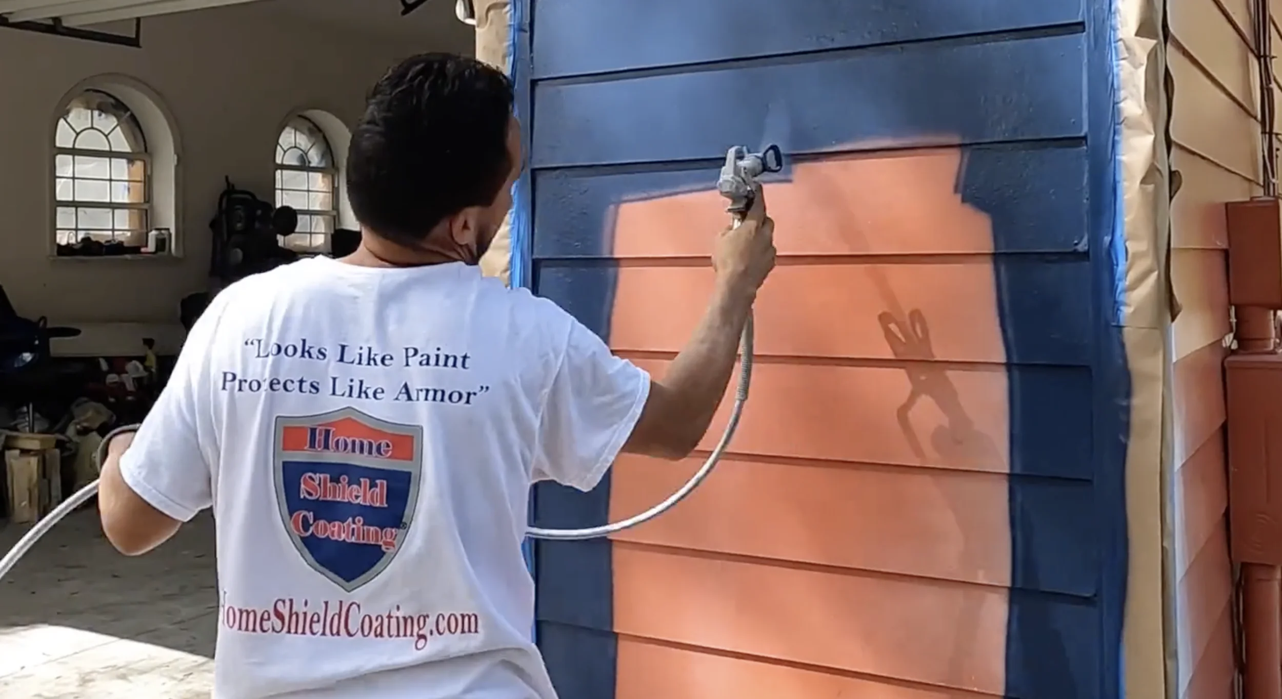 Home Shield Coating being sprayed on Hardie Board.